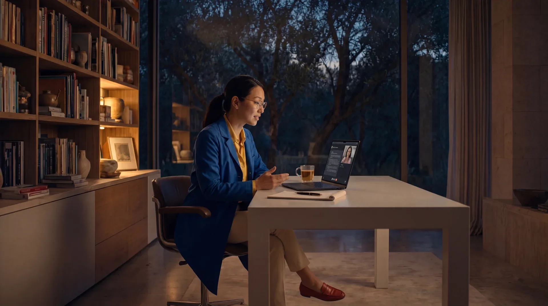 A Mindspan specialist working at her desk in the evening.